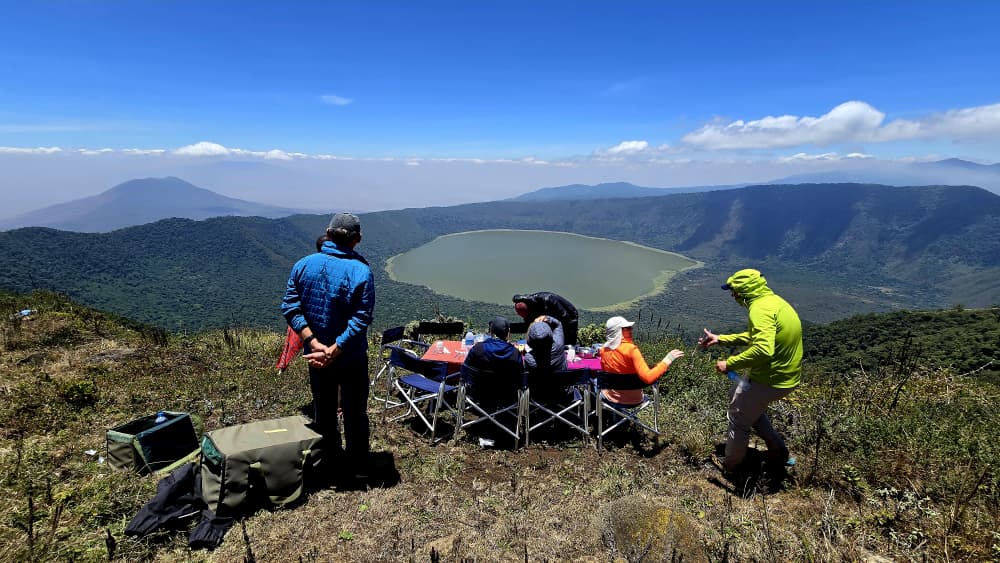 Tourists enjoying safari with crater view